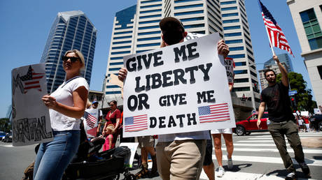 FILE PHOTO: Demonstrators in San Diego are shown protesting California's Covid-19 lockdown in May 2020.