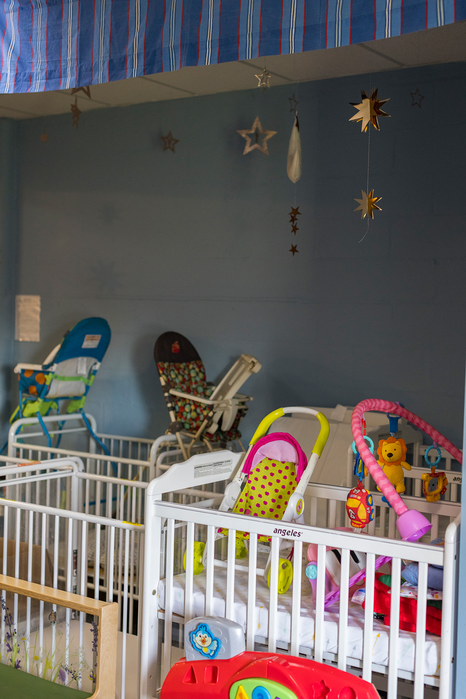 The daycare is still filled with colorful toys and star mobiles dangling above cribs, but most classrooms are now empty of children.