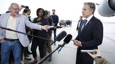 US Secretary of State Antony Blinken speaks with journalist prior to board a plane to travel to Brussels ahead of a meeting with NATO counterparts.