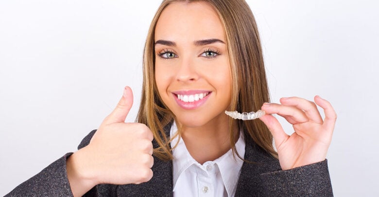 Young business woman wearing jacket over white background