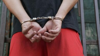 Photo by Kindel Media: https://www.pexels.com/photo/a-person-in-black-shirt-wearing-handcuffs-7785099/