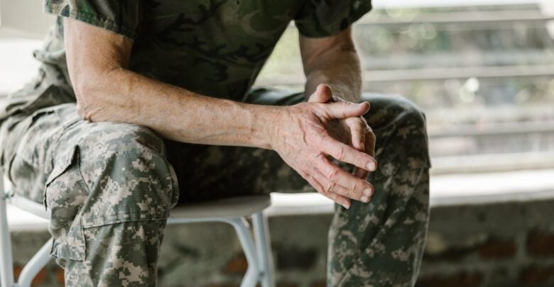 Photo by RDNE Stock project: https://www.pexels.com/photo/man-in-green-and-brown-camouflage-shirt-7468215/